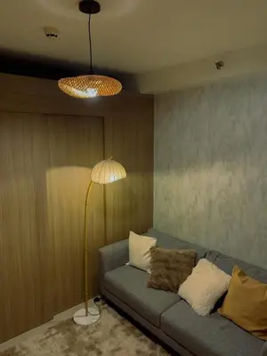 a living room with a couch and a lamp at condo near MOA&NAIA&Bay, full length mirror&balcony in Manila
