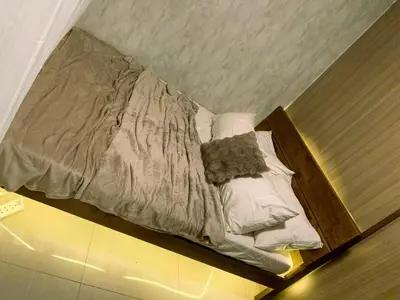 a unmade bed sitting on the floor in a room at condo near MOA&NAIA&Bay, full length mirror&balcony in Manila