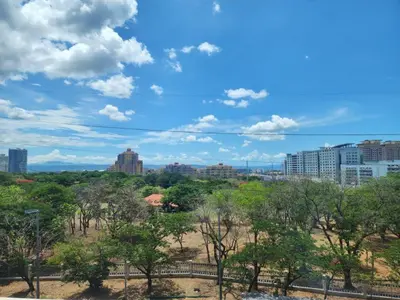 a view of the city from a park at Modern 1 br in Park Mckinley West with Breathtaking view fast internet in Manila