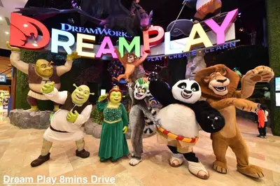 a group of disney characters on a dance floor with the words dream team at 2BR ManilaBay 180 Seaview Beside Okada 14 in Manila