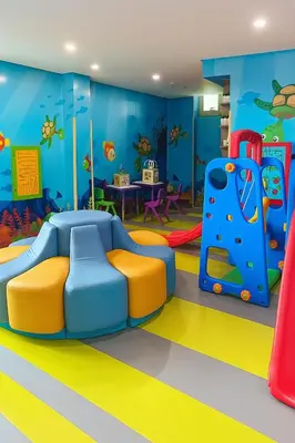 a childrens play room with a slide and play equipment at 2BR ManilaBay 180 Seaview Beside Okada 14 in Manila