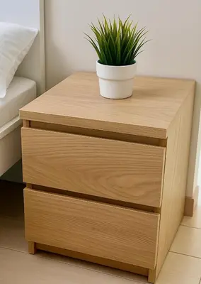 a wooden bedside table with a potted plant on it at 2BR ManilaBay 180 Seaview Beside Okada 14 in Manila