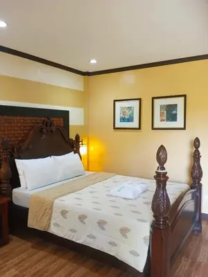 a bedroom with a large bed in a room at La Traviesa Hotel Resort in General Trias