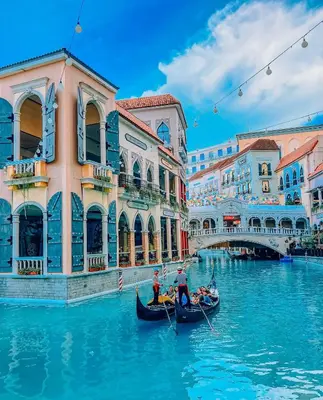 a group of people in a gondola on a canal at Mariz Suites in Manila