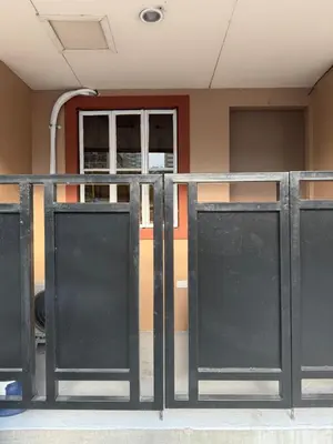 a group of doors in front of a building at Studio Room near Circuit Makati in Manila