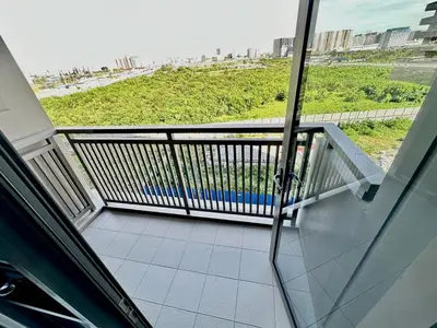 a balcony with a view of the beach at Stylish Luxe Apt in Gentry Manor in Manila