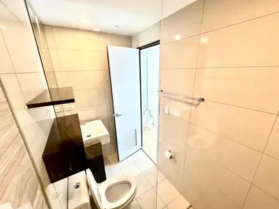 a bathroom with a toilet and a shower at Stylish Luxe Apt in Gentry Manor in Manila