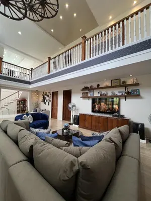 a large living room with a large couch at El Casa Azul in Amadeo