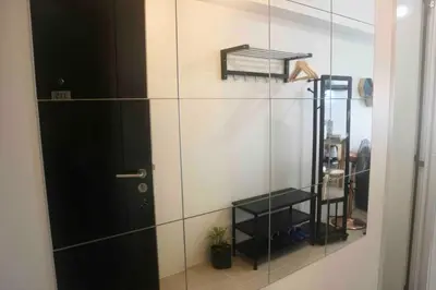 a glass shower with a black door in a room at Dreamy Studio with Netflix and High Speed Wifi in Manila