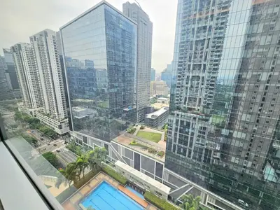 a view of a city with tall buildings at The Infinity Towers in BGC - Spacious 2 Bedroom - View, Washer, Fast WiFi in Manila
