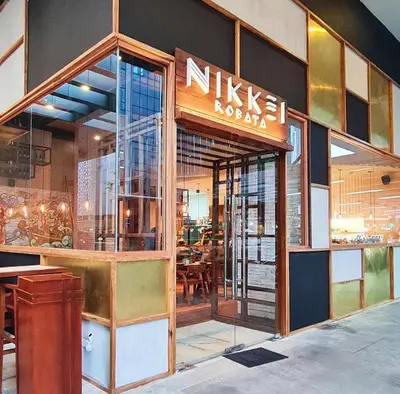 a nikki books store with a sign on the door at BGC 1BR with Fast wifi and Pool use in Manila