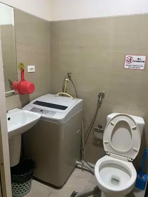 a small bathroom with a toilet and a sink at Shore residence A41 shortwalk mall of asia in Manila