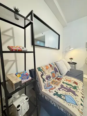 a bedroom with a bunk bed and a shelf at MOA Staycation at Shore Residences Tower C in Manila