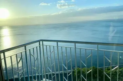a view of the ocean from a balcony at Modern Seaview 1BR Near Okada Manila Bay Airport 17 in Manila