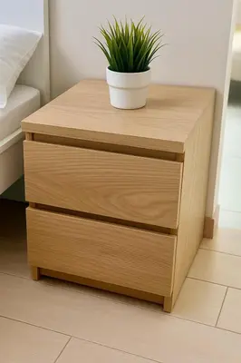 a wooden bedside table with a potted plant on it at Modern Seaview 1BR Near Okada Manila Bay Airport 17 in Manila