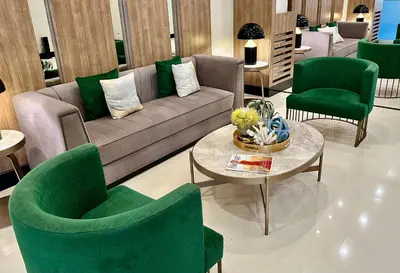 a living room with a couch and green chairs at Modern Seaview 1BR Near Okada Manila Bay Airport 17 in Manila