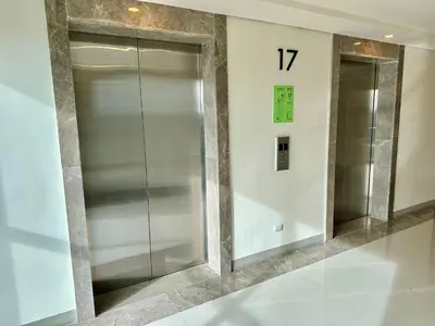 two elevators in a building with the number seventeen at Modern Seaview 1BR Near Okada Manila Bay Airport 17 in Manila