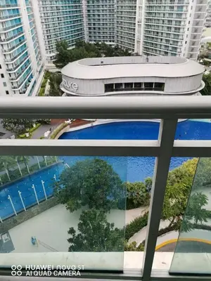 a collage of two pictures of a building at Azure Urban Resort Residences in Manila