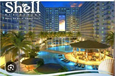 a magazine cover of a resort with a swimming pool at Dona staycation in Manila