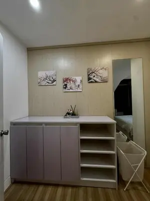 a room with a counter with a sink and a mirror at Miyu's Staycation Place in Biñan