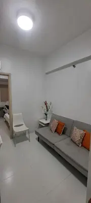 a living room with a couch and a chair at Soap's Haven Rental Unit in Paranaque in Manila