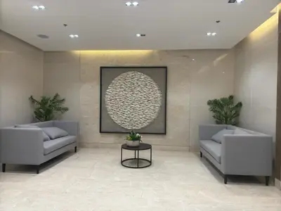 a lobby with two couches and a picture on the wall at JM's CRIB in Manila