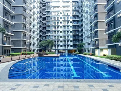 a large swimming pool in the middle of a building at JM's CRIB in Manila