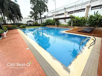 a swimming pool in the middle of a building at Studio City Alabang Pool Access Free for 2 Wifi & Netflix SC5 in Manila