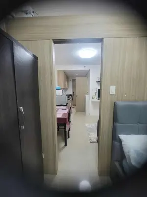 a view of a dining room and kitchen with a table at Apartment Condo Unit 1-br Self-contained in Manila