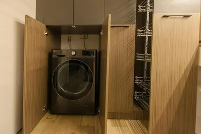 a washer and dryer in a small room at cityscapethe39th at Eastwood Global Plaza - Luxury Residences in Manila
