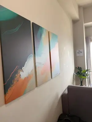 a group of four paintings hanging on a wall at Coast Residences 40th Floor Penthouse Pasay Manila in Sampong