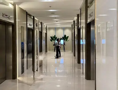 a man standing in a hallway in a building at Coast Residences 40th Floor Penthouse Pasay Manila in Sampong
