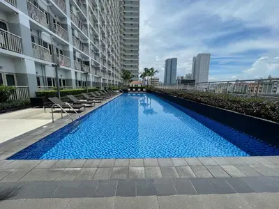a swimming pool in the middle of a building at Coast Residences 40th Floor Penthouse Pasay Manila in Sampong