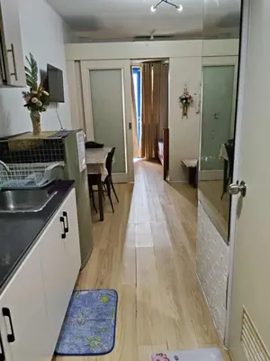a kitchen with a sink and a counter top at Sea residence MOA KC PLACE in Manila