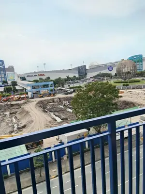 a view of a construction site from a balcony at Sea residence MOA KC PLACE in Manila