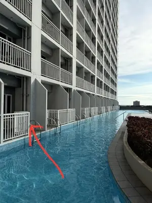 a swimming pool in the middle of a building at Pocco-breeze- inhouse pool in Manila