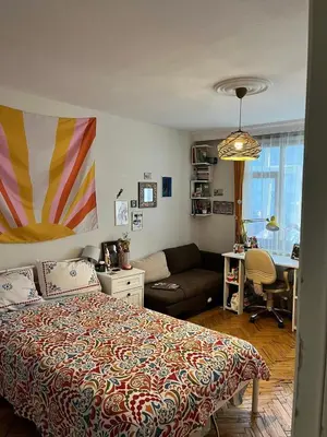 a bedroom with a bed and a couch and a desk at Becca's double bedroom alongside Metrobank Makati in Manila