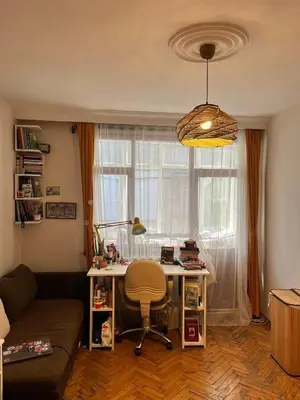 a living room with a desk in front of a window at Becca's double bedroom alongside Metrobank Makati in Manila