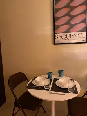 a white table with plates and glasses on it at Pocco-breeze-moonlight in Manila