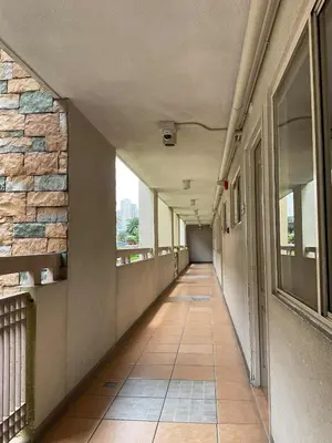 an empty hallway of a building with a walk way at DBK HOMES Sorrento Oasis in Manila