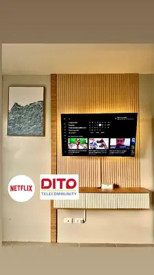 a tv on a wall in a room at Condotel Near NAIA T1, T2 and CAAP in Manila