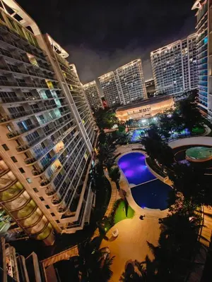 an aerial view of a city at night at Azure Urban Resort Residences Parañaque City in Manila