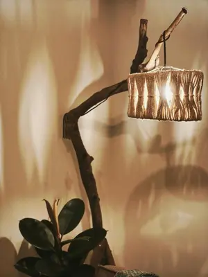 a chandelier hanging from a wall next to a plant at Condo- Park McKinleyWest Big1Br unit -Pool View in Manila