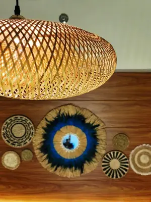 a chandelier hanging from a ceiling with plates on a wall at Condo- Park McKinleyWest Big1Br unit -Pool View in Manila