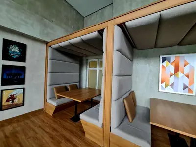 a small room with a table and chairs at Condo- Park McKinleyWest Big1Br unit -Pool View in Manila