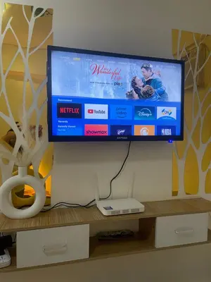 a flat screen tv hanging on a wall at Sky Condotel Staycation in Manila