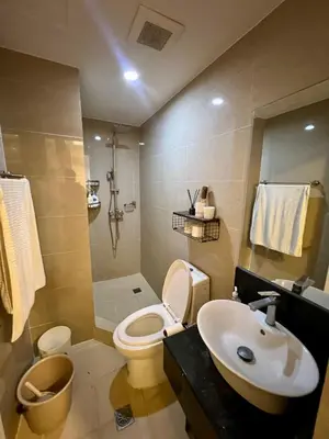 a bathroom with a toilet and a sink at SRR NAIA T3 - Month of January - New Year PROMO Php 1,999 - 1 BR Interior Designed Unit in Manila