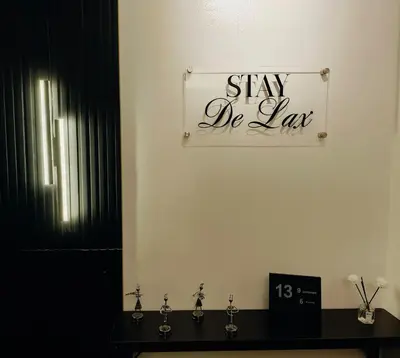 a bathroom with a sign that says stay de lax at Stay De Lax in Santa Rosa