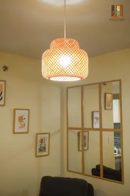 a room with a pendant light and a mirror at Pause Point - Standford 3 Suites in Silang