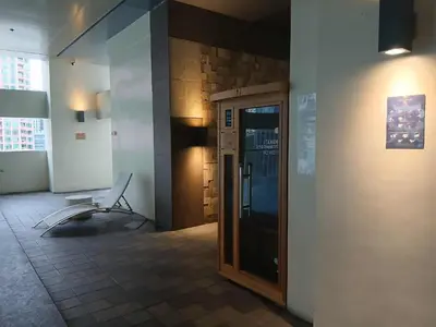 a room with a door and a chair on a wall at Condo 2 bedroom victoria de makati in Manila